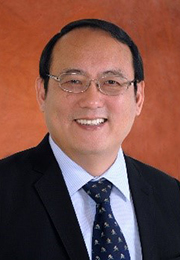 Headshot of Dr. Chang Hsien Tai wearing a suit and tie smiling