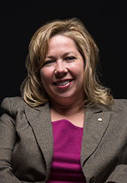 Headshot of Tricia Mack smiling