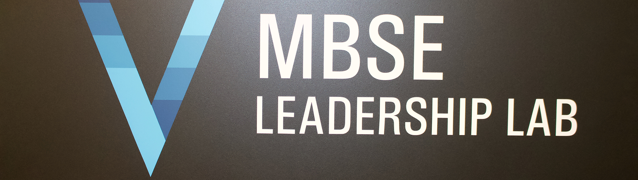 MBSE Leadership lab logo with a blue "V"